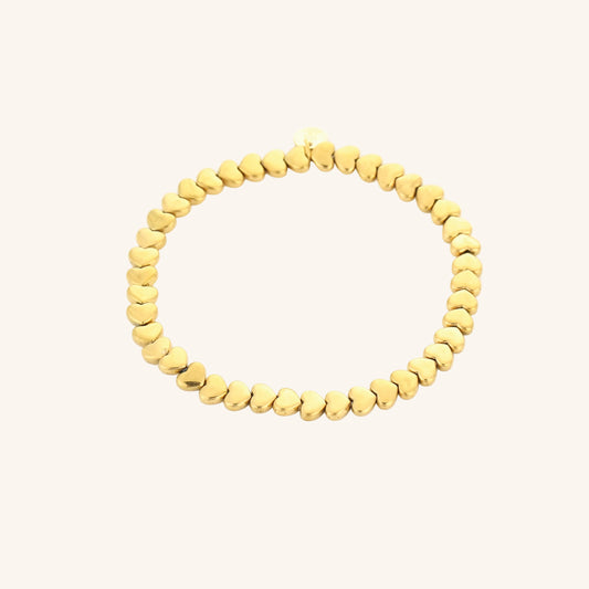 Elastische Kralenarmband Hartjes — Goud